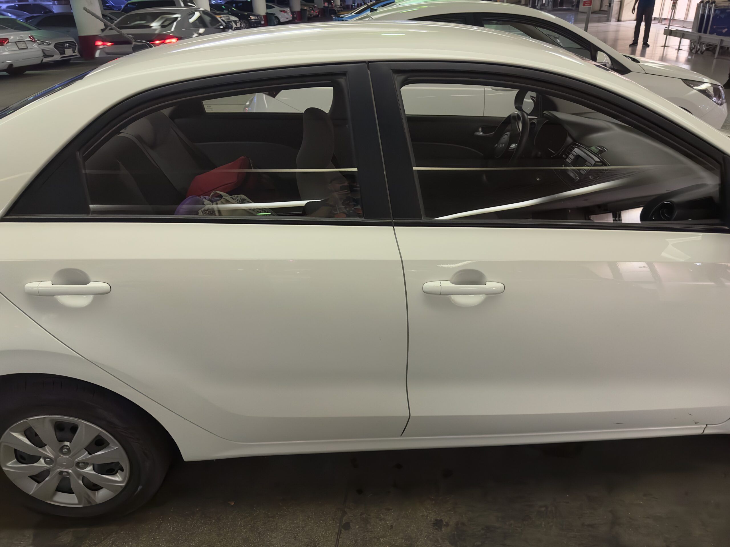 White sedan in an indoor parking garage in saudi arabia