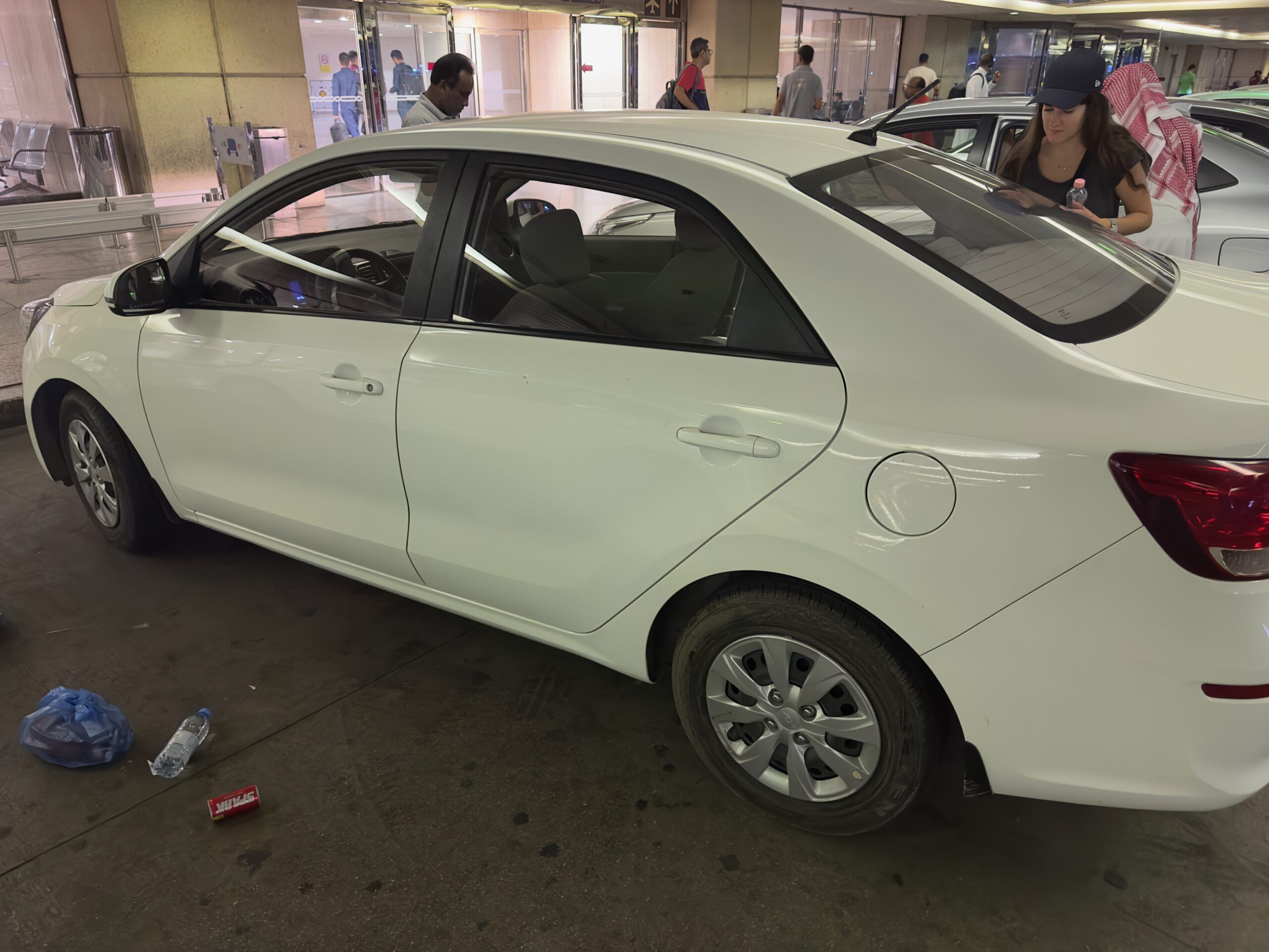 White rental car at an airport in saudi arabia.