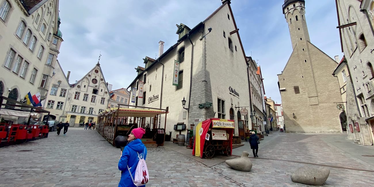 Tallinn old town square with historic churches and a street market stalls in estonia