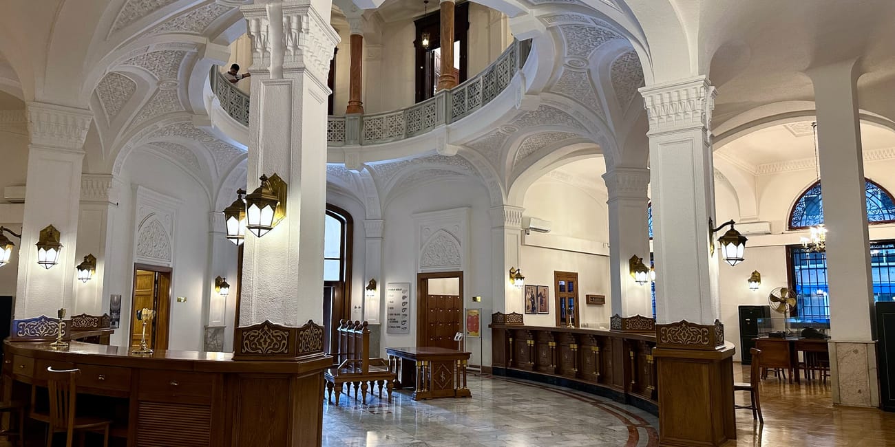 An interior hall at turkey’s ankara economic independence museum with ornate arches, columns, and polished marble floors