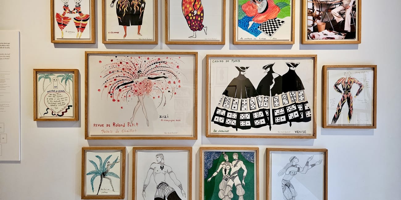 Framed yves saint laurent fashion illustrations on a wall, marrakech.