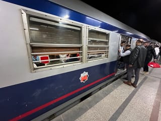 Passengers boarding a metro train in egypt at a station platform.