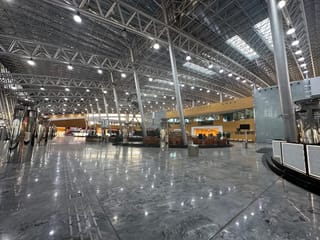 Modern public transport terminal in saudi arabia with a spacious glass-and-steel interior.