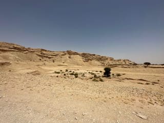 Riyadh heet cave desert landscape in saudi arabia with rocky hills and sparse shrubs