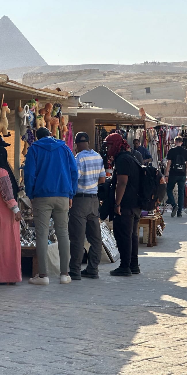 Tourist stalls near the pyramids of giza in egypt with shoppers and souvenirs