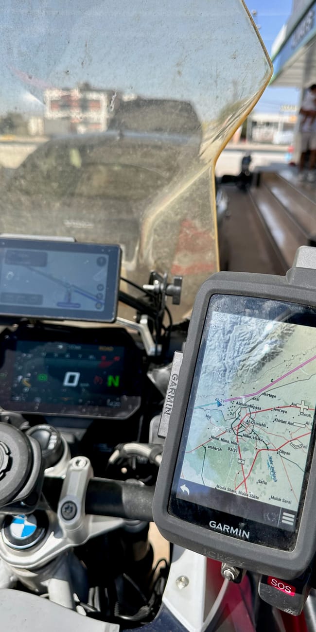 Motorcycle cockpit with garmin navigation and route map on the desert horizons motorcycle expedition, turkey road to iraq