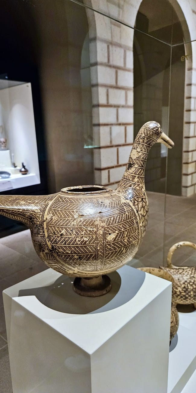 Ancient bird-shaped vessel on display at turkey’s ankara civilization museum, behind glass exhibit walls
