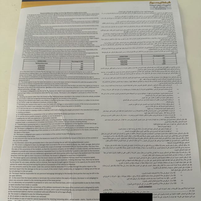 Autounion car rental contract in english and arabic on a table in egypt