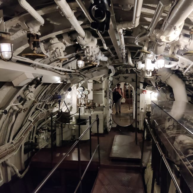 Tallinn article photo showing the interior of an industrial ship engine room with pipes and steps