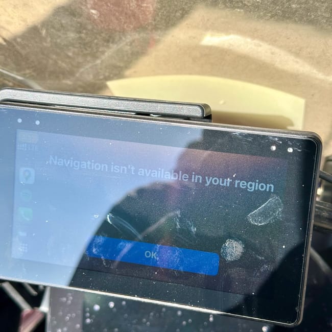 Motorcycle navigation screen showing “navigation isn’t available in your region” on the turkey road to iraq route