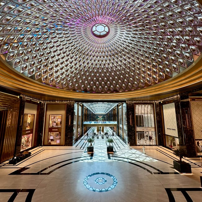 Kuwait city’s the avenues indoor atrium with a mirrored, dome-like ceiling and bright central walkway