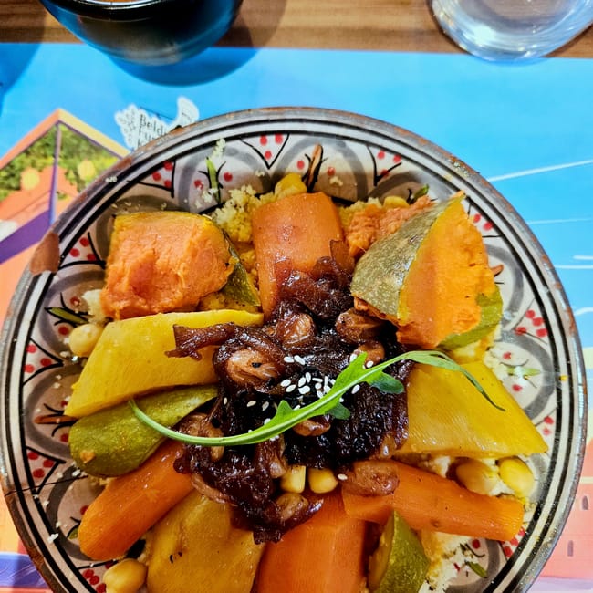 Morocco, marrakech foods: colorful plate of tagine with vegetables and sesame garnish