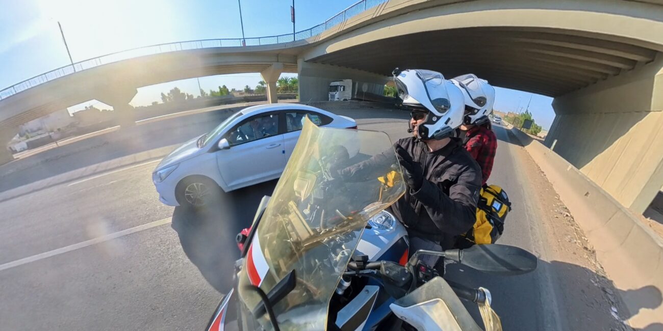 Iraq, baghdad people in car on road
